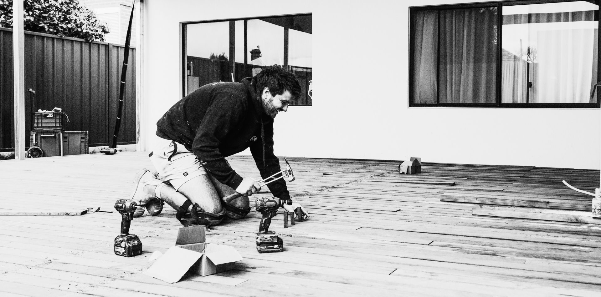 Adelaide Sure Fix carpenter installing hardwood timber decking boards at a residential property